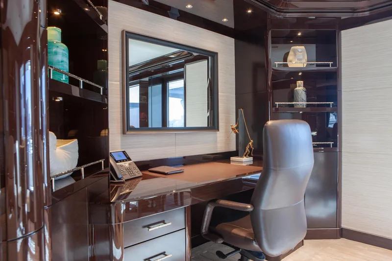 Boardwalk Yacht Photos Pics Luxurious yacht office interior with leather chair, desk, and decorative shelves, Feadship Custom 2021.