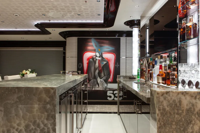Boardwalk Yacht Photos Pics Luxurious yacht interior with marble bar, modern art, and premium liquor display, Feadship Custom 2021.