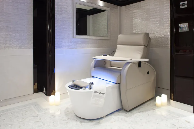 Boardwalk Yacht Photos Pics Luxurious pedicure chair in a modern spa setting, featuring Feadship Costum 2021 design.
