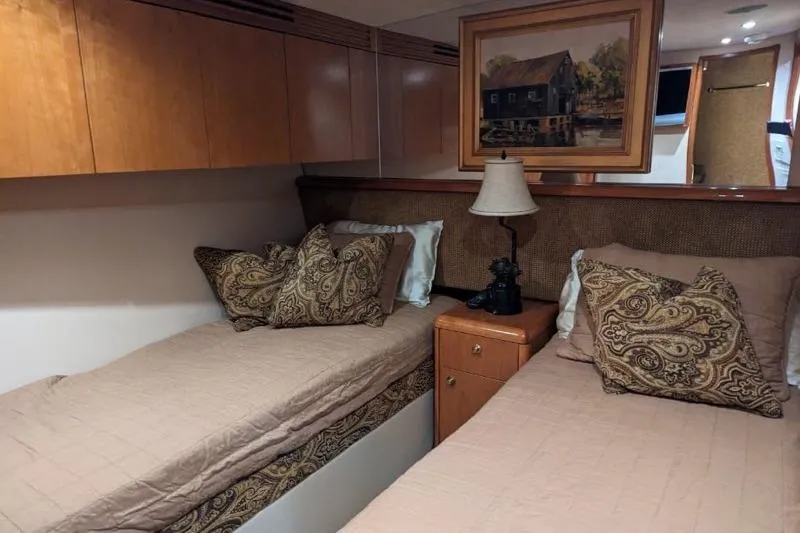  Yacht Photos Pics Interior of 2007 Hatteras 68 Convertible yacht with twin beds and elegant decor.