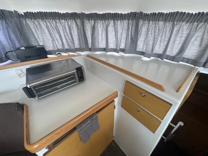 Isaphil Yacht Photos Pics Interior of 2013 Lagoon 380 S2 yacht with kitchenette and appliances.