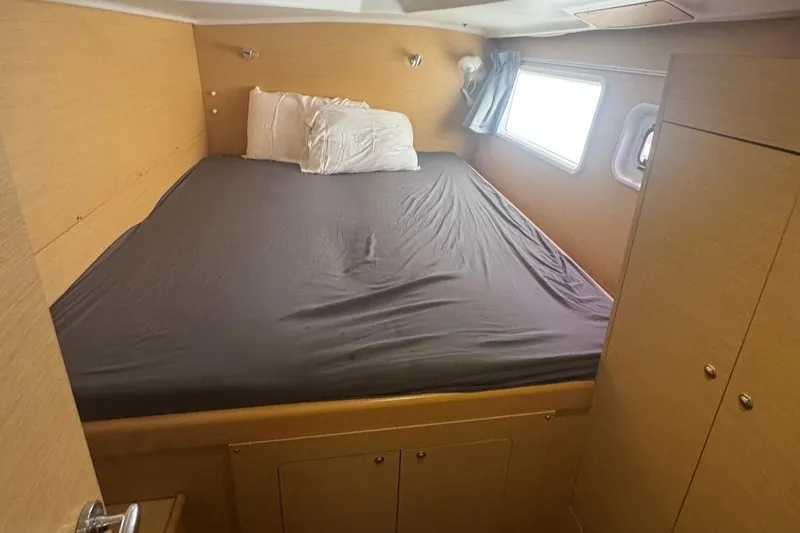 Isaphil Yacht Photos Pics Cozy cabin bedroom in 2013 Lagoon 380 S2 catamaran with natural light.