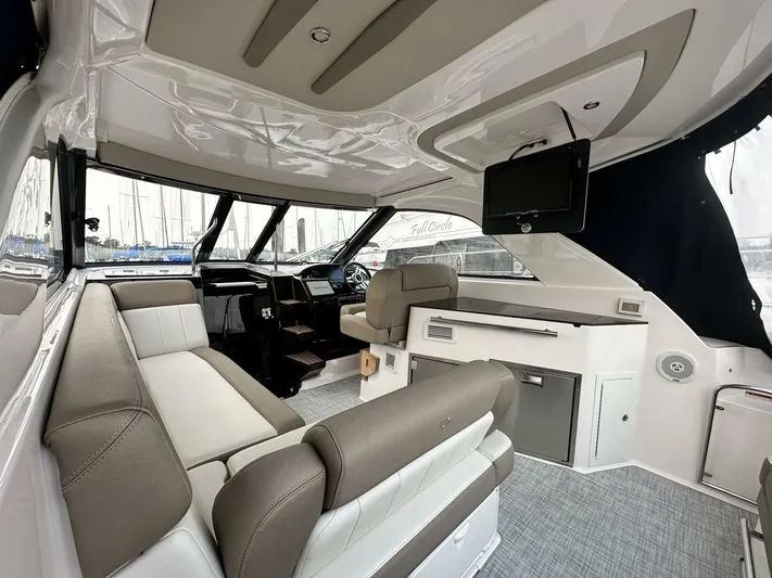  Yacht Photos Pics 2014 Regal Sport Coupe interior with modern seating, sleek design, and mounted TV.