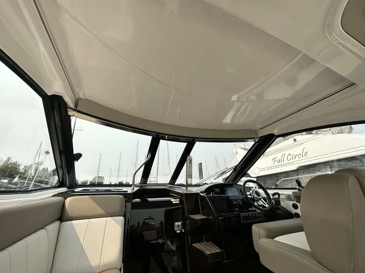  Yacht Photos Pics 2014 Regal Sport Coupe interior with beige seating and modern dashboard.