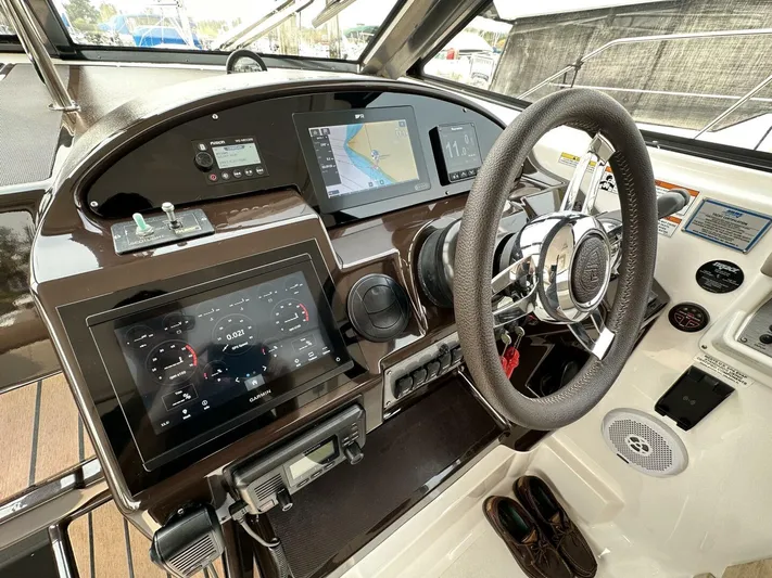  Yacht Photos Pics 2014 Regal Sport Coupe dashboard with navigation screens and steering wheel.