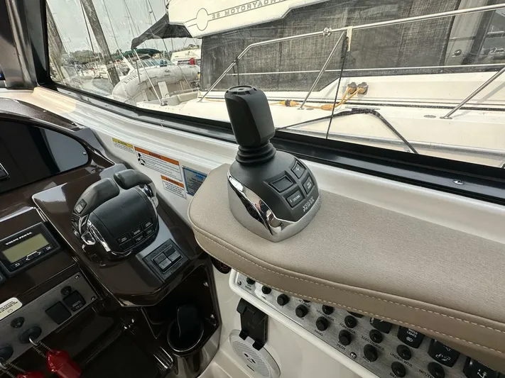  Yacht Photos Pics Control panel of a 2014 Regal Sport Coupe boat with joystick and throttle.