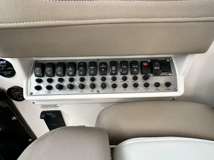  Yacht Photos Pics Control panel of a 2014 Regal Sport Coupe with multiple switches and buttons.