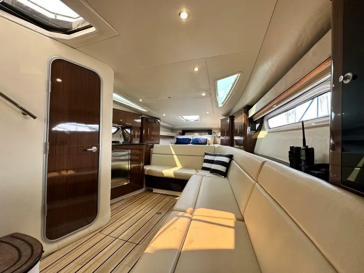  Yacht Photos Pics Luxurious interior of a 2014 Regal Sport Coupe yacht with elegant seating and wood finishes.