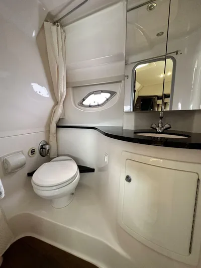  Yacht Photos Pics 2014 Regal Sport Coupe bathroom with modern fixtures, white cabinetry, and a sleek countertop.