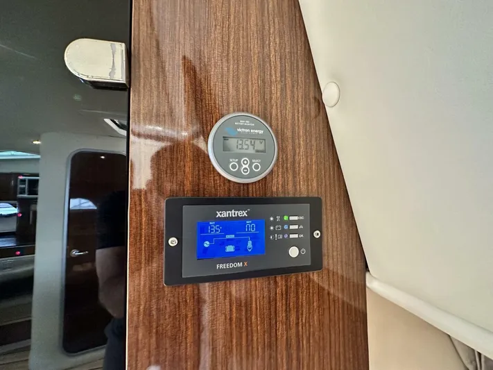  Yacht Photos Pics Control panel inside 2014 Regal Sport Coupe, featuring Xantrex Freedom X display.