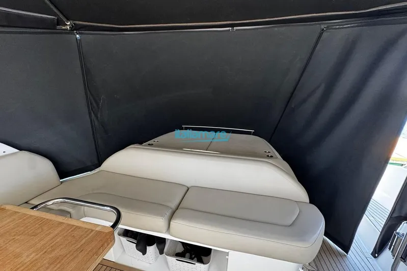  Yacht Photos Pics Interior of 2020 Azimut Atlantis 45 yacht with beige seating and wooden table.