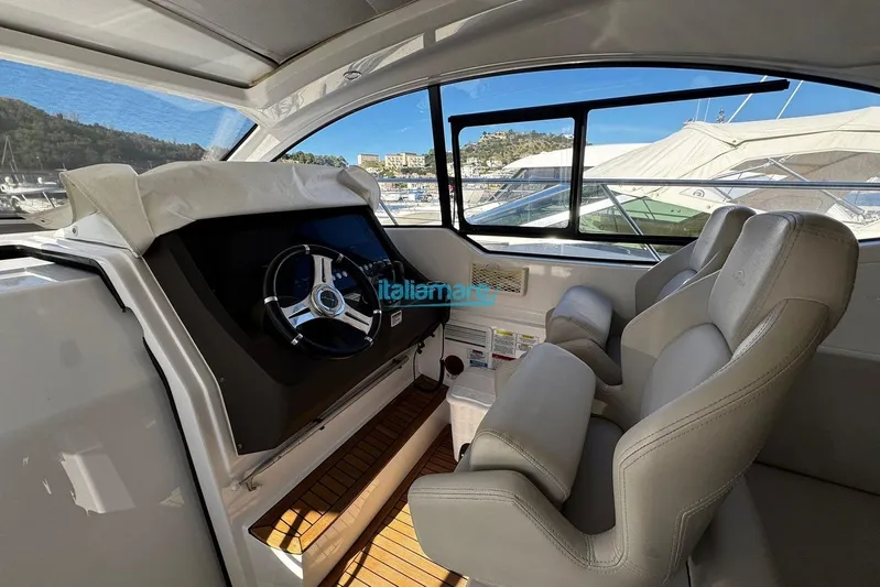  Yacht Photos Pics Interior of 2020 Azimut Atlantis 45 yacht with steering wheel and leather seats.
