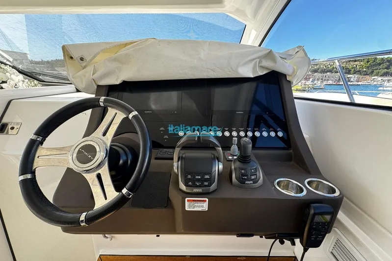  Yacht Photos Pics Cockpit of 2020 Azimut Atlantis 45 yacht with steering wheel and control panel.