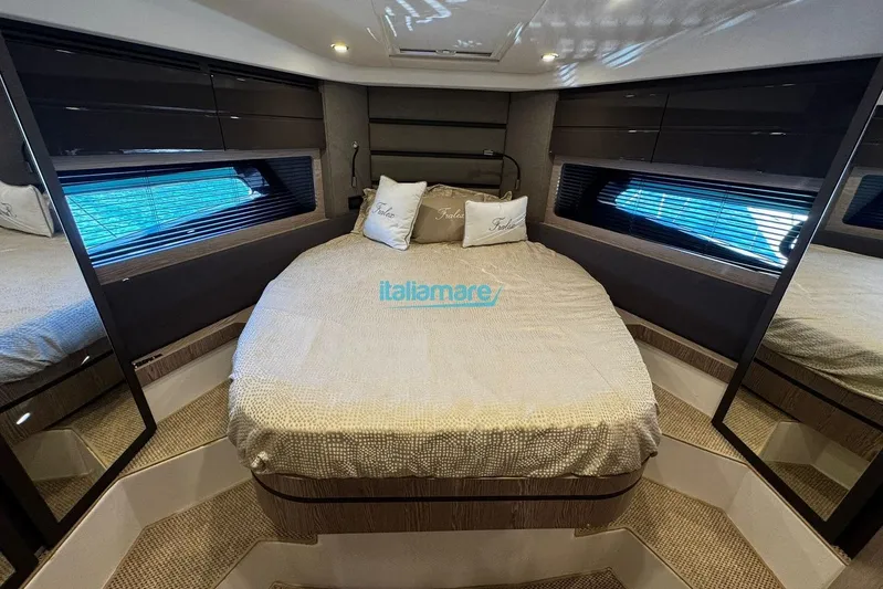  Yacht Photos Pics Luxurious bedroom interior of 2020 Azimut Atlantis 45 yacht with elegant bedding and modern design.