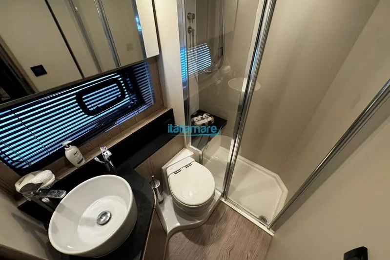  Yacht Photos Pics Luxurious bathroom in 2020 Azimut Atlantis 45 yacht with modern fixtures and shower.