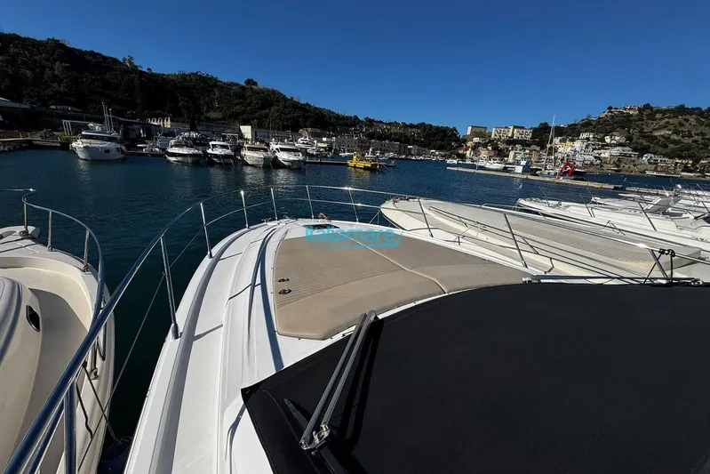  Yacht Photos Pics 2020 Azimut Atlantis 45 yacht docked in a scenic marina.