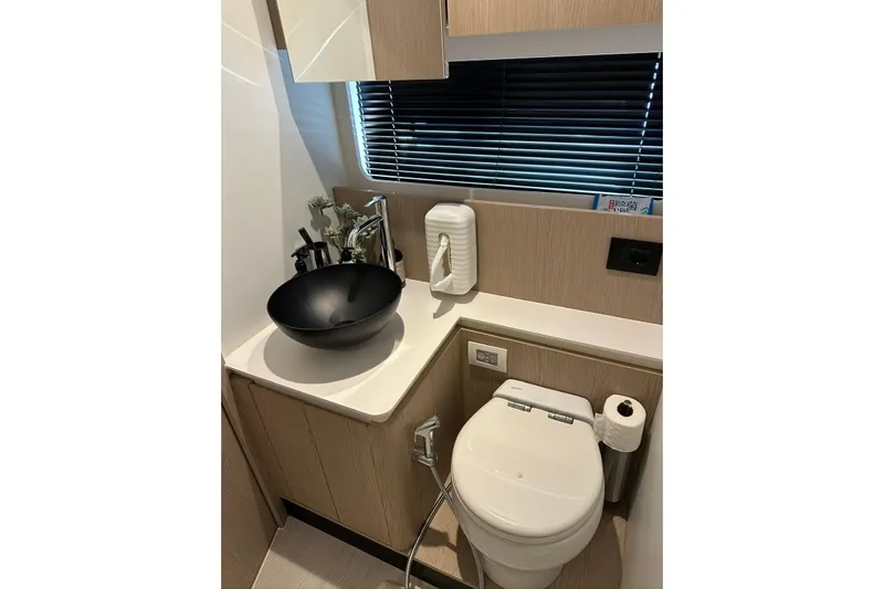  Yacht Photos Pics Luxurious bathroom in 2024 Azimut Fly 53 yacht with modern fixtures and elegant design.