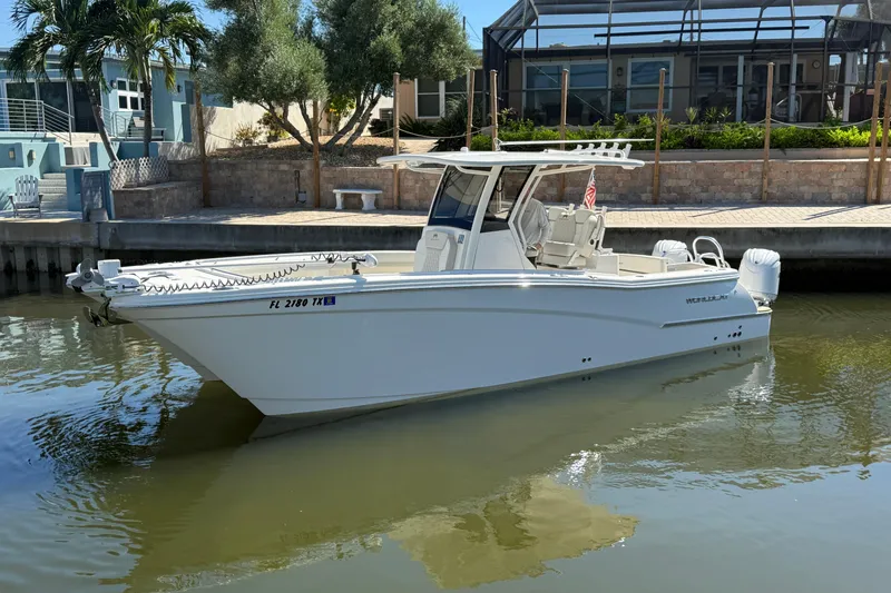  Yacht Photos Pics 2025 World Cat 280 CC-X boat docked in a serene waterfront setting.