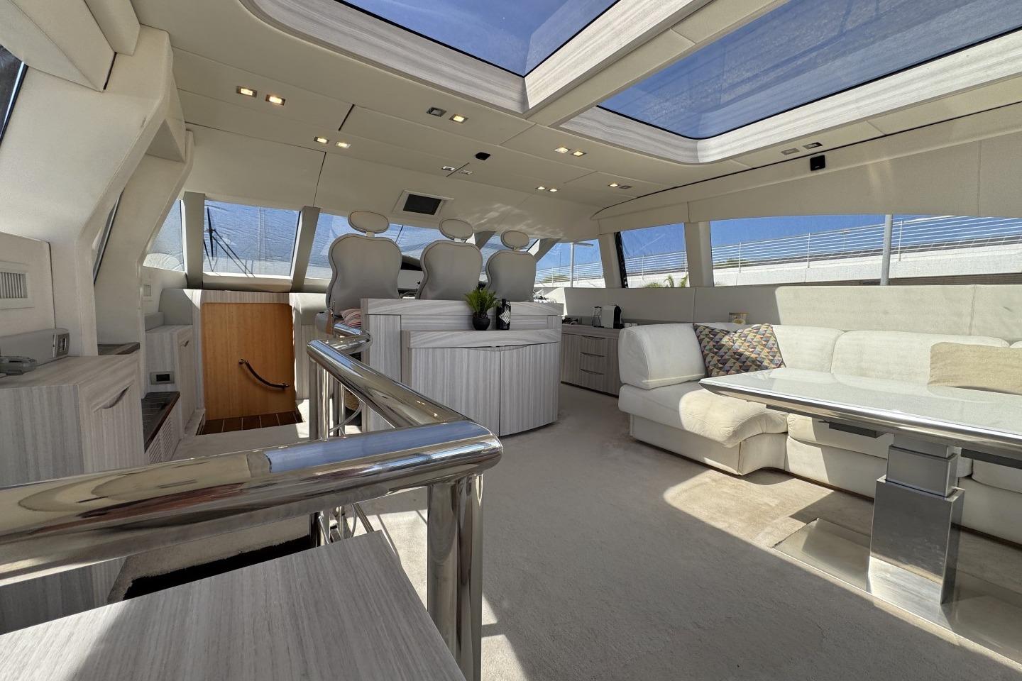 Luxurious interior of 2007 AB 78 yacht with modern seating and panoramic windows.