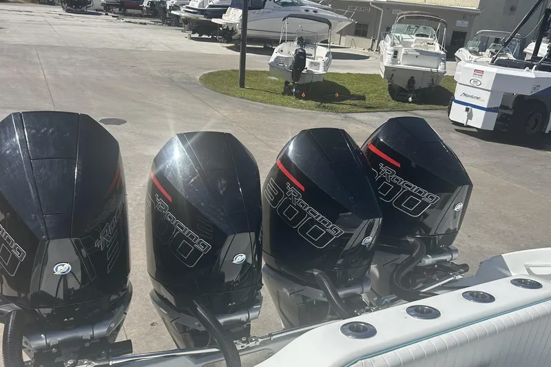  Yacht Photos Pics Four powerful outboard motors on a 2009 Yellowfin 42 Offshore boat at a marina.