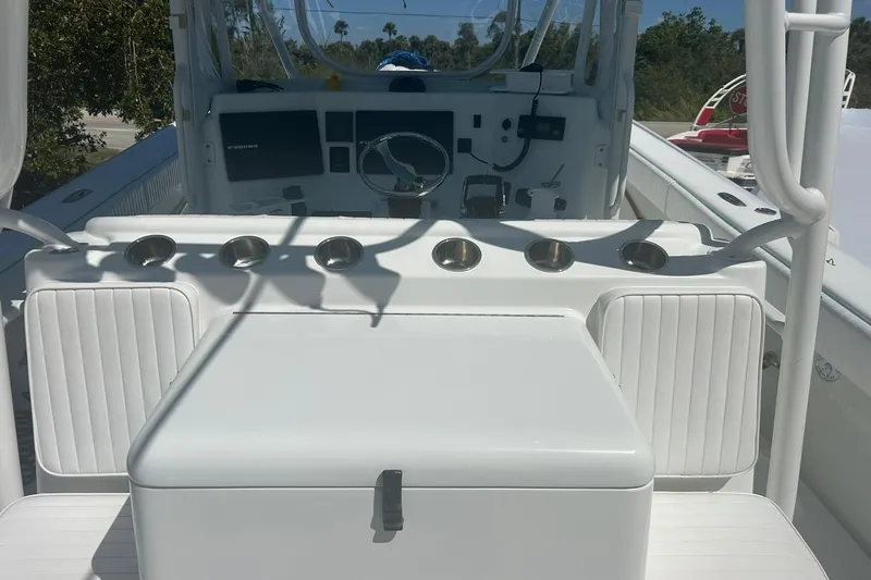  Yacht Photos Pics 2009 Yellowfin 42 Offshore boat cockpit with seating and control panel.