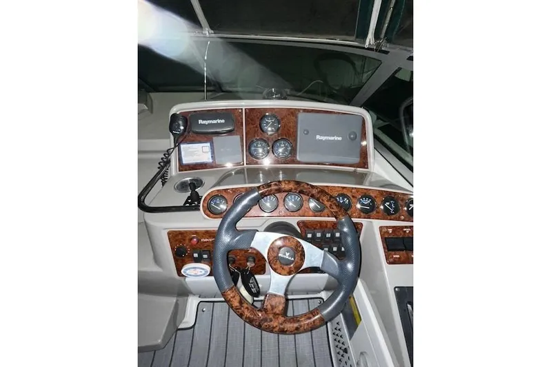 Yacht Photos Pics 2004 Formula 34 Performance Cruiser dashboard with Raymarine navigation system and wood accents.