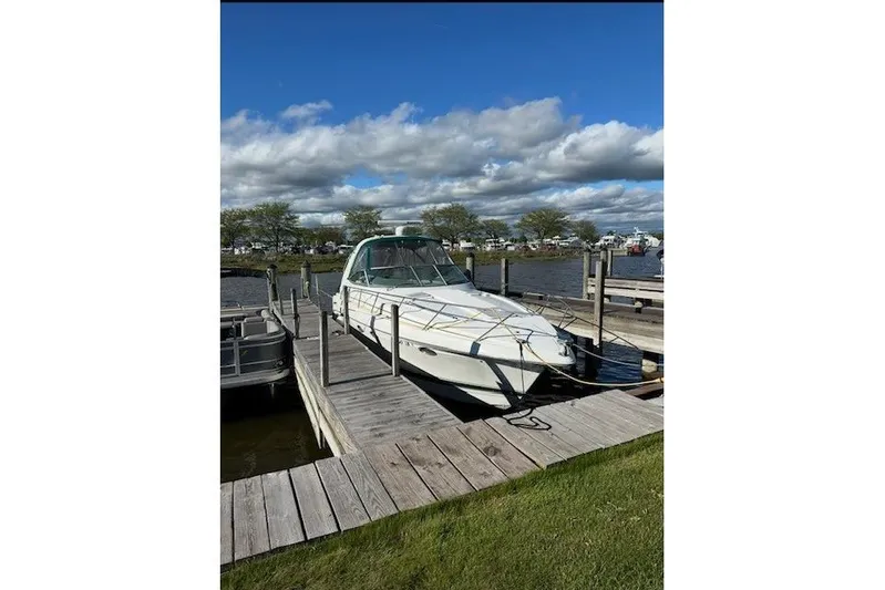  Yacht Photos Pics 2004 Formula 34 Performance Cruiser docked at a marina under a blue sky.