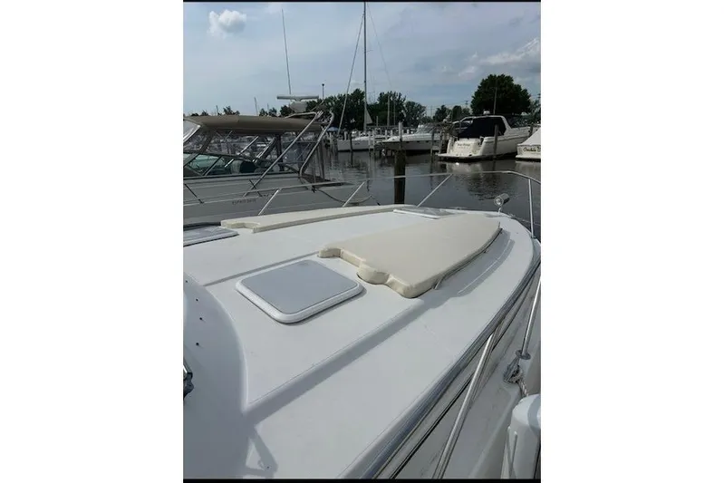  Yacht Photos Pics 2004 Formula 34 Performance Cruiser docked at marina, featuring sleek deck design.