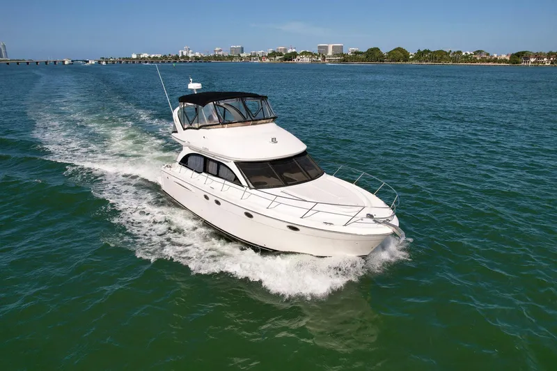 Vrpro Yacht Photos Pics 2007 Meridian 411 Sedan cruising on open water under clear skies.