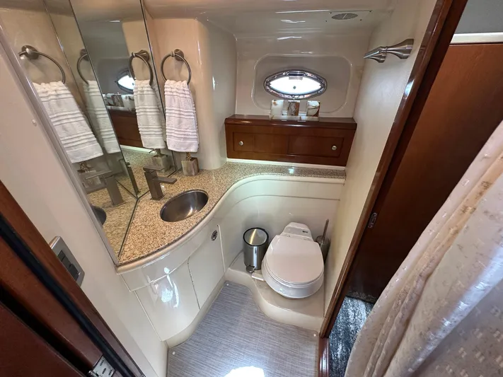 Vrpro Yacht Photos Pics Luxurious bathroom in 2007 Meridian 411 Sedan yacht with modern fixtures and elegant design.