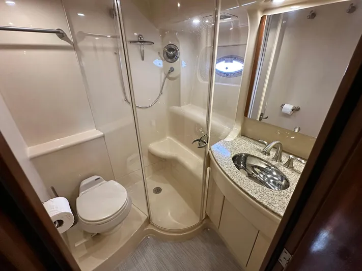 Vrpro Yacht Photos Pics Luxurious bathroom in 2007 Meridian 411 Sedan yacht with shower, toilet, and sink.