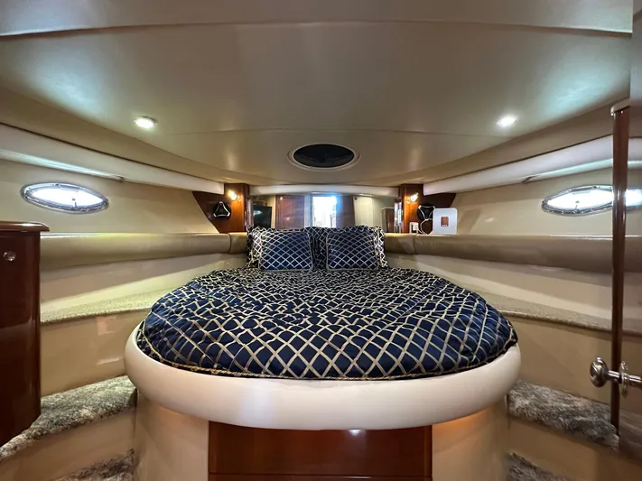 Vrpro Yacht Photos Pics Luxurious interior of 2007 Meridian 411 Sedan yacht with elegant bedding and ambient lighting.