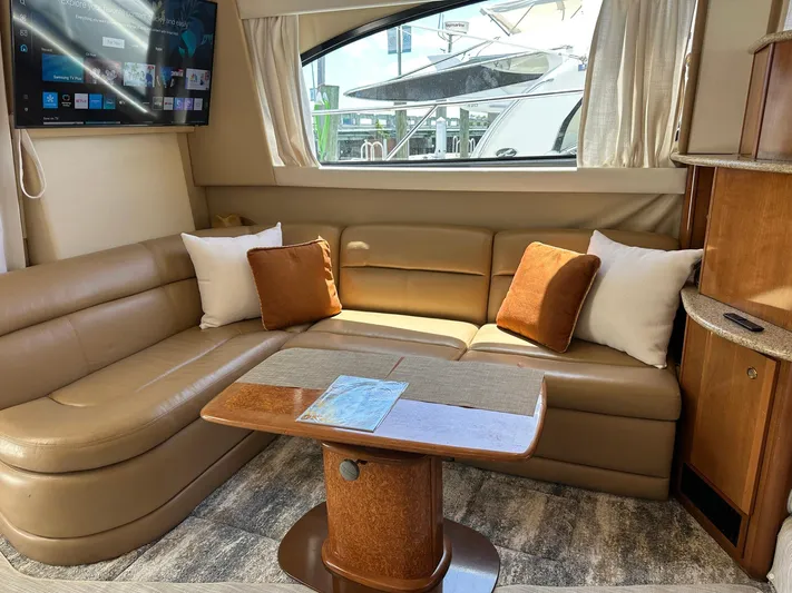 Vrpro Yacht Photos Pics Luxurious interior of 2007 Meridian 411 Sedan with leather seating and wooden table.