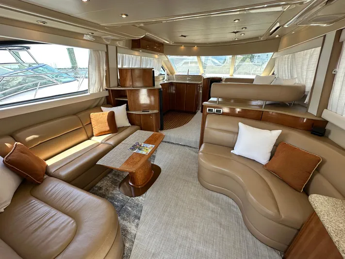 Vrpro Yacht Photos Pics Luxurious interior of a 2007 Meridian 411 Sedan yacht with elegant seating and wood finishes.