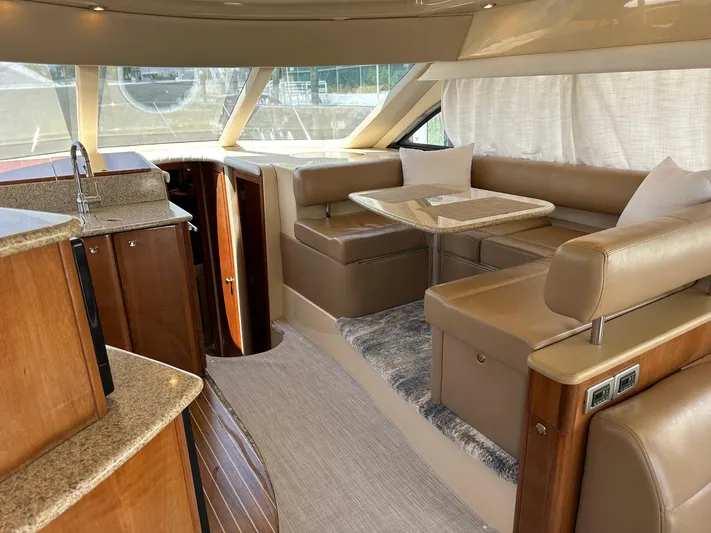 Vrpro Yacht Photos Pics Luxurious interior of a 2007 Meridian 411 Sedan yacht with elegant seating and dining area.