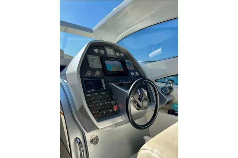  Yacht Photos Pics Cockpit of 2007 Pershing 50 yacht with navigation controls and steering wheel.