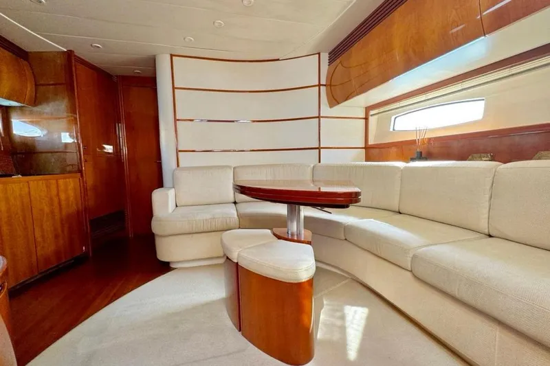  Yacht Photos Pics Luxurious interior of a 2007 Pershing 50 yacht with elegant wood and cream furnishings.