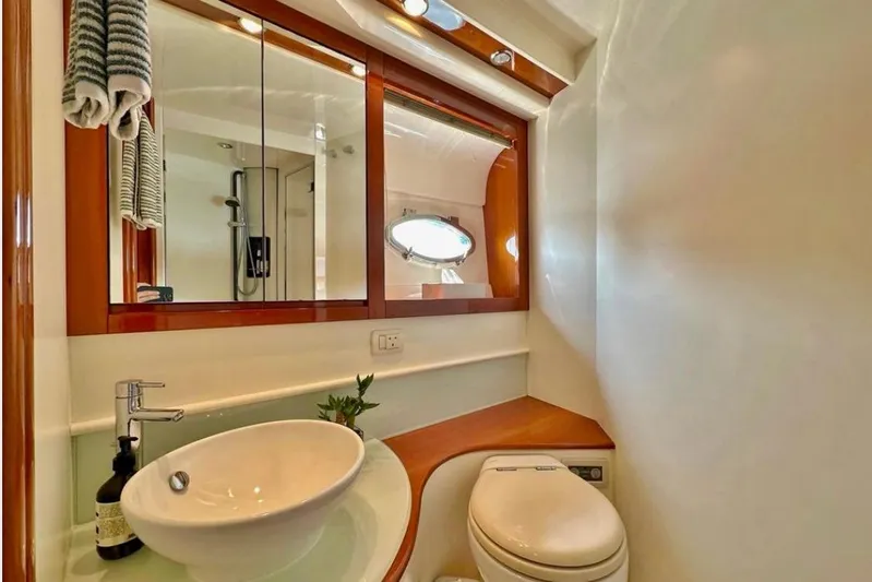  Yacht Photos Pics Luxurious bathroom interior of 2007 Pershing 50 yacht with modern fixtures and elegant design.