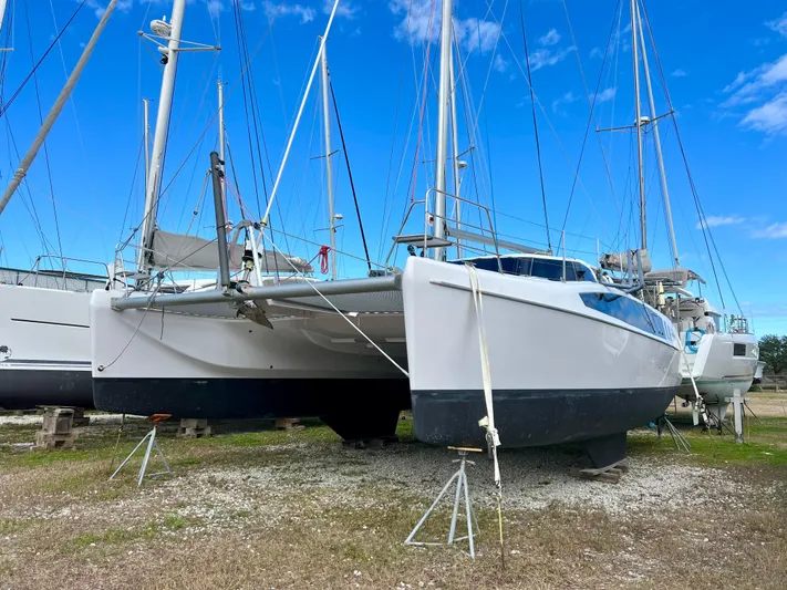 Kestrel Yacht Photos Pics Seawind 1260 catamaran, 2020 model, on land with clear blue sky background.