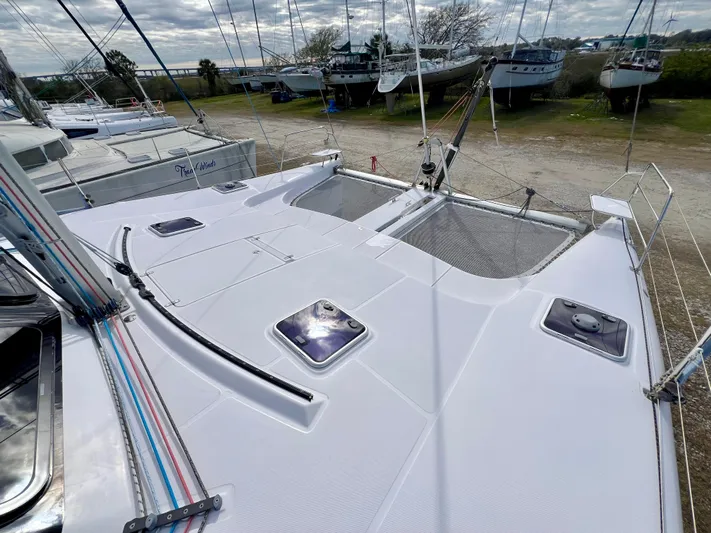 Kestrel Yacht Photos Pics 2020 Seawind 1260 catamaran deck with hatches and rigging, docked on land.