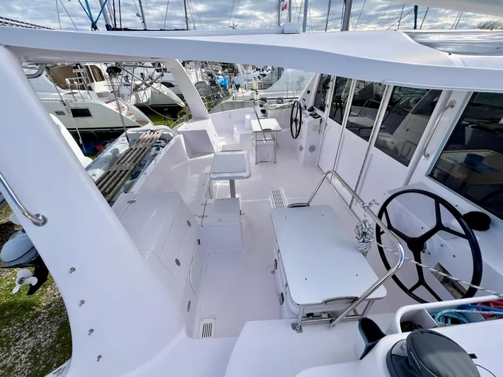 Kestrel Yacht Photos Pics Seawind 1260 catamaran cockpit, 2020 model, featuring dual steering wheels and spacious seating area.