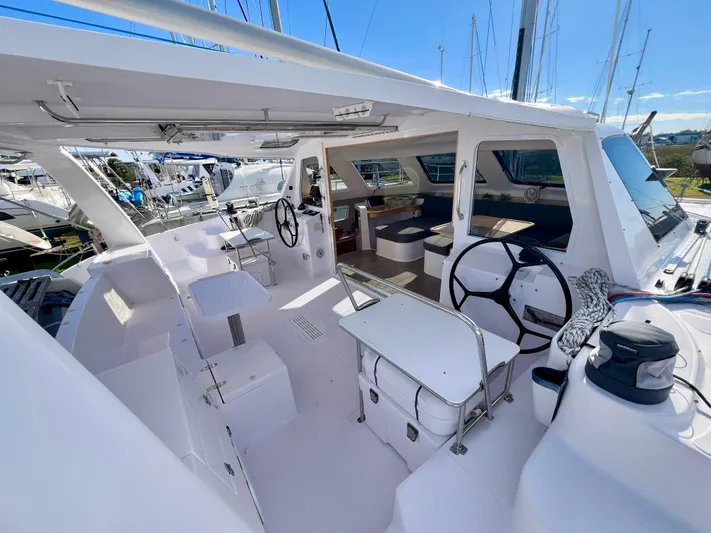 Kestrel Yacht Photos Pics 2020 Seawind 1260 catamaran interior with dual steering wheels and spacious seating area.