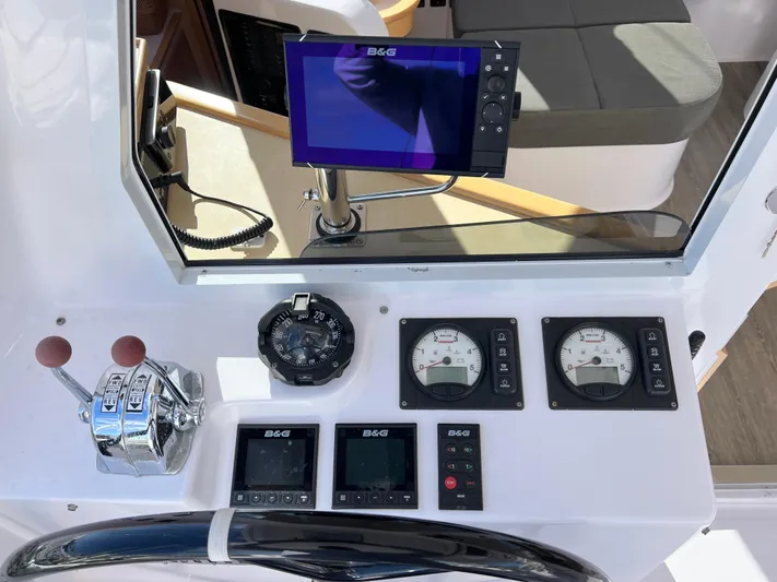 Kestrel Yacht Photos Pics Seawind 1260 2020 helm with navigation instruments and controls.