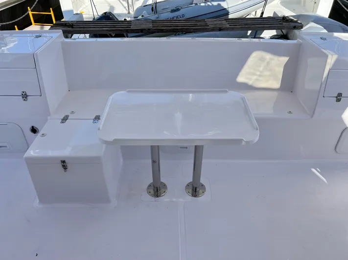 Kestrel Yacht Photos Pics Seawind 1260 catamaran cockpit with white seating and table, 2020 model.