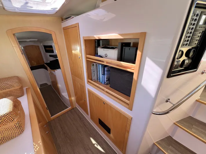 Kestrel Yacht Photos Pics Interior of 2020 Seawind 1260 catamaran with wooden shelves and modern design.