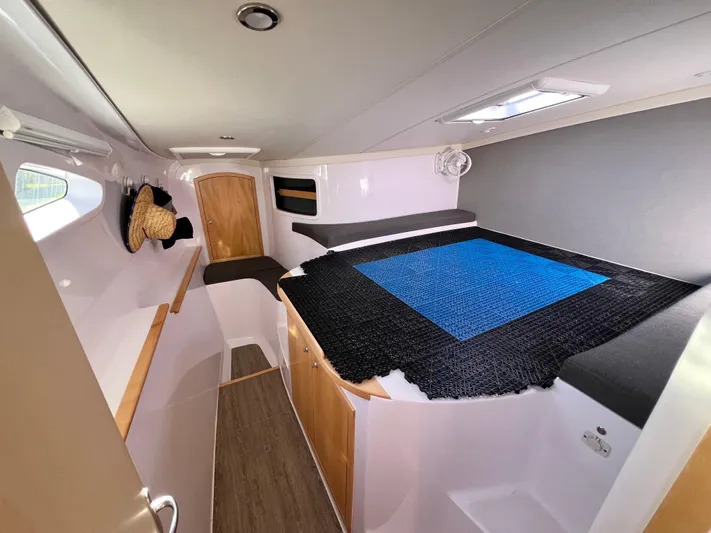 Kestrel Yacht Photos Pics Interior of 2020 Seawind 1260 catamaran cabin with modern design and cozy sleeping area.