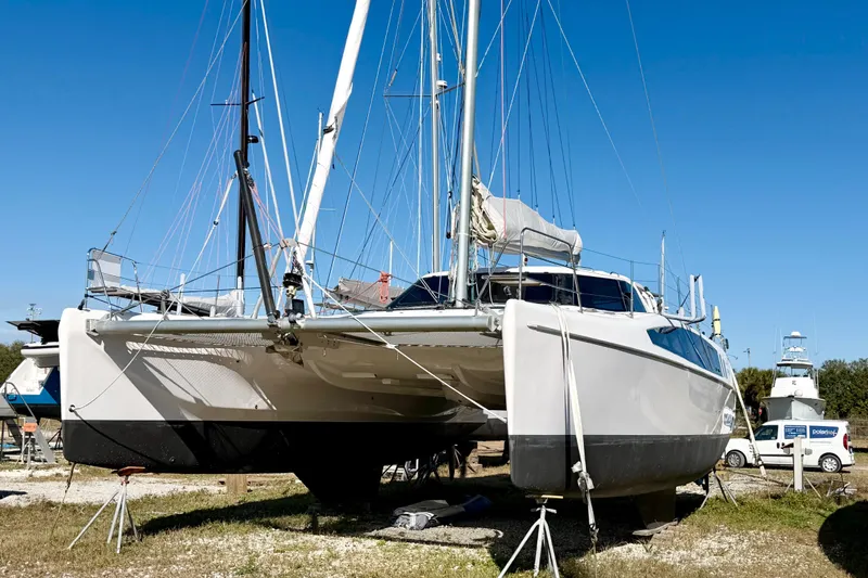 Kestrel Yacht Photos Pics 2020 Seawind 1260 catamaran on land, blue sky background, ready for maintenance.