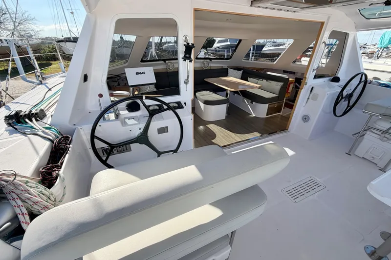 Kestrel Yacht Photos Pics Interior view of 2020 Seawind 1260 catamaran, featuring helm and spacious seating area.