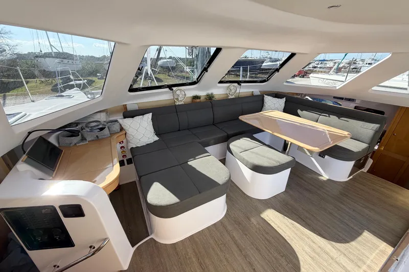 Kestrel Yacht Photos Pics Interior of 2020 Seawind 1260 catamaran with modern seating and panoramic windows.