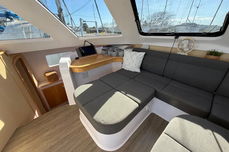 Kestrel Yacht Photos Pics Modern interior of 2020 Seawind 1260 catamaran with spacious seating and natural light.